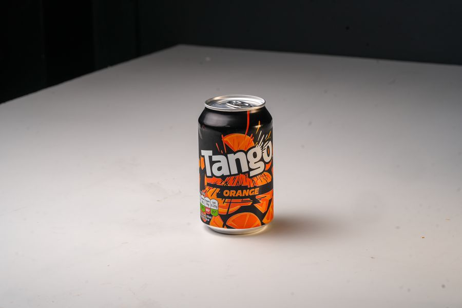 Ice-cold can of Tango orange on the counter